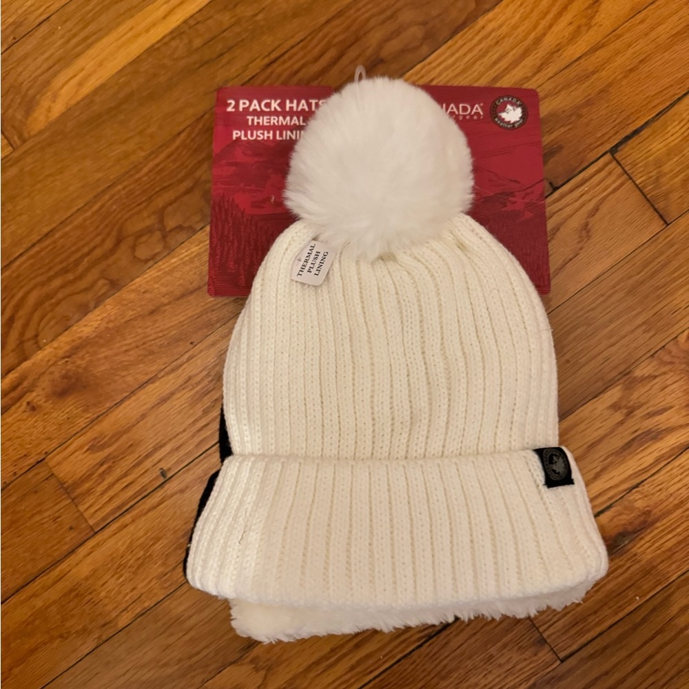 Canada Weather Gear 2 piece Hat set, new with tags, one black one white